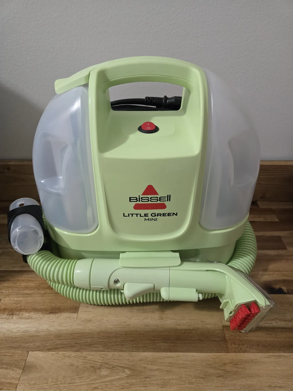 Our Bissell Little Green Mini — the dirty water that comes out of a "clean" couch cushion is genuinely disturbing