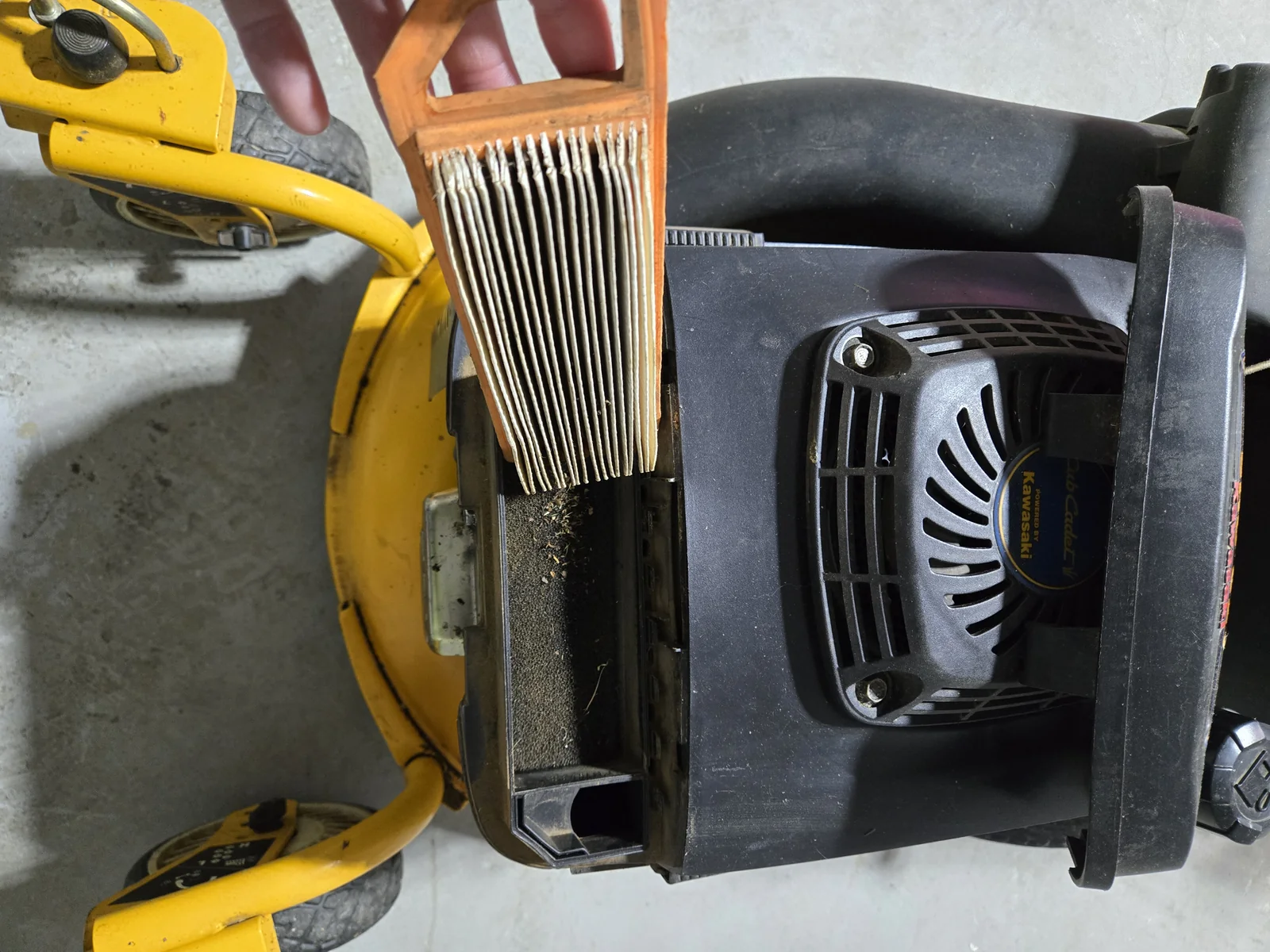 Pulling the old air filter from the Kawasaki engine on the SRC621 — Cub Cadet branded but Kawasaki underneath