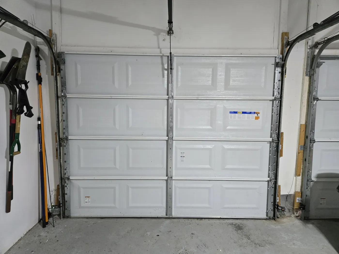 My garage door from the inside — every hinge, roller, and spring on it gets lubricated twice a year