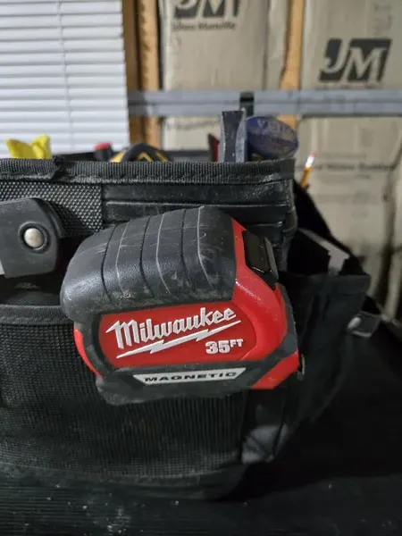 My Milwaukee 35ft Magnetic tape measure — this thing has been through years of projects