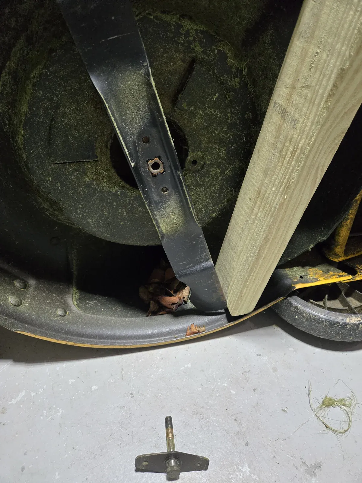 Blade bolt and bow-tie retainer out, blade loose in the deck