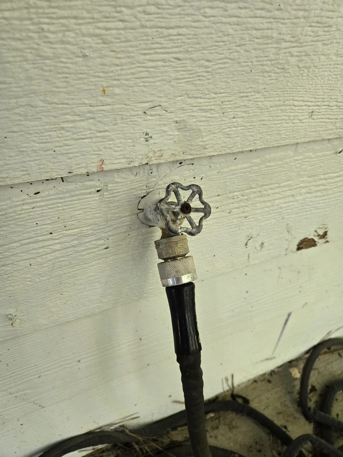 Hose bib with a brass quick-connect — disconnecting for winter takes five seconds