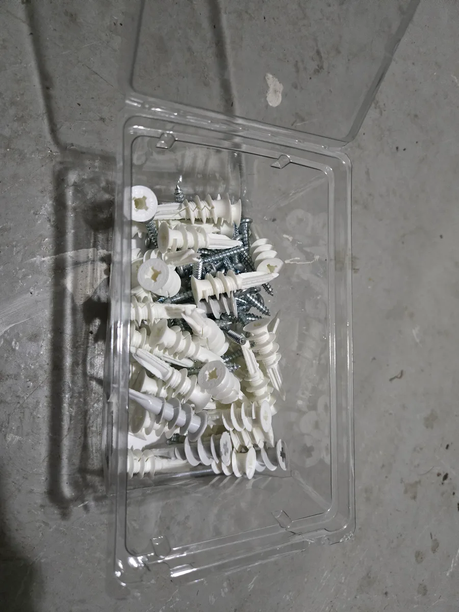 Box of self-drilling plastic drywall anchors with screws — the workhorse for light-to-medium duty projects