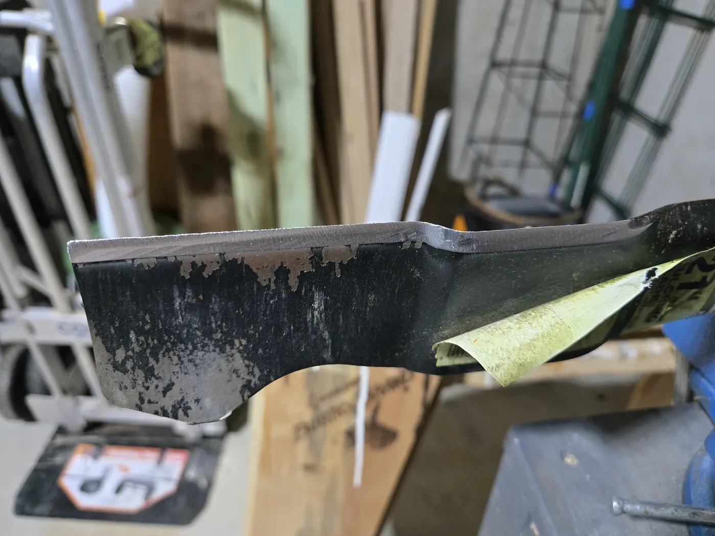 Freshly sharpened mower blade edge with a clean bright bevel
