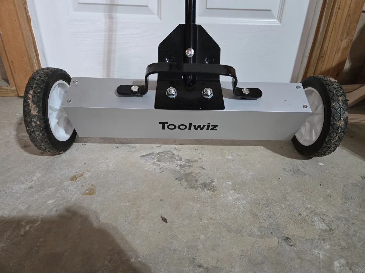 The Toolwiz magnetic sweeper — 24-inch magnet base with wheels and telescoping handle
