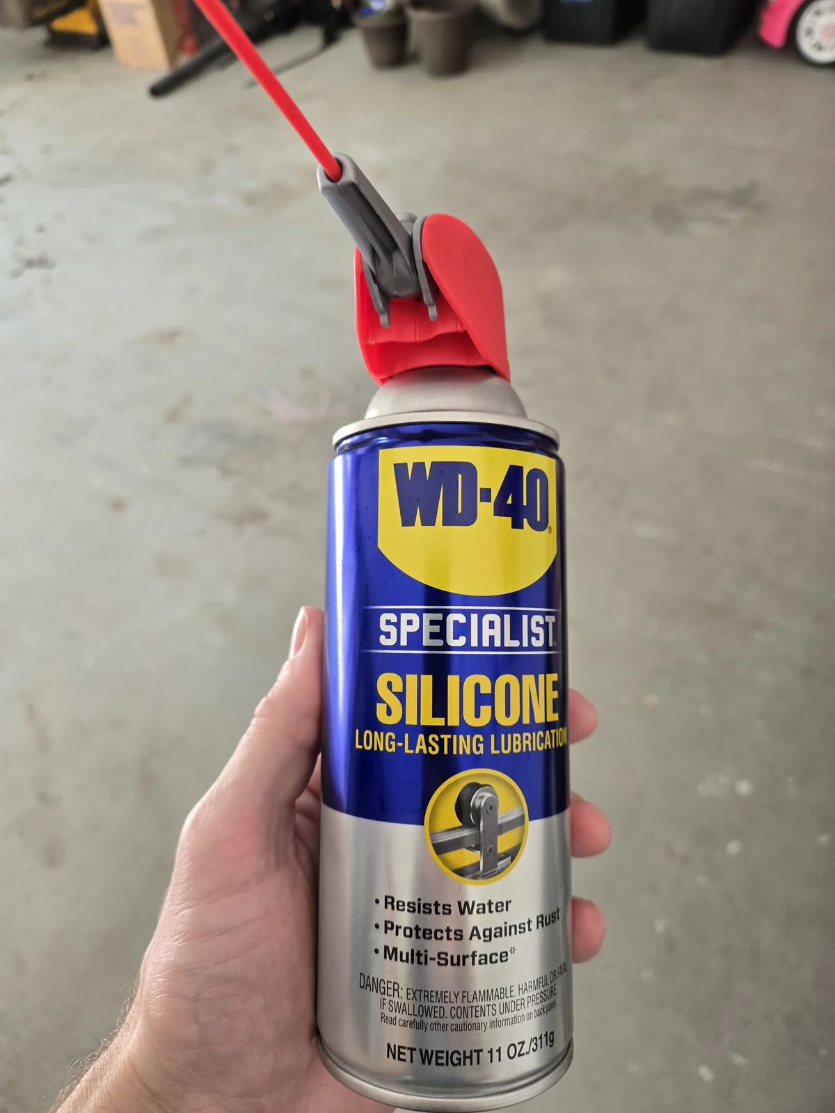 WD-40 Specialist Silicone with the Smart Straw flipped up — the straw is what lets you aim into hinge knuckles