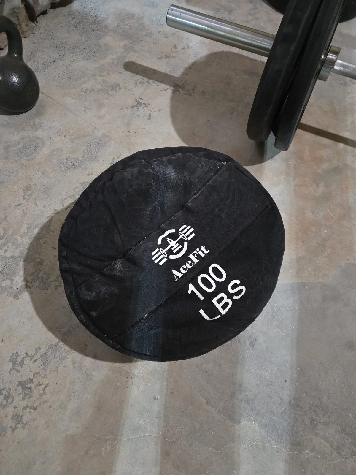 The AceFit 100 LB sandbag — the shifting sand inside makes every rep different, just like grappling