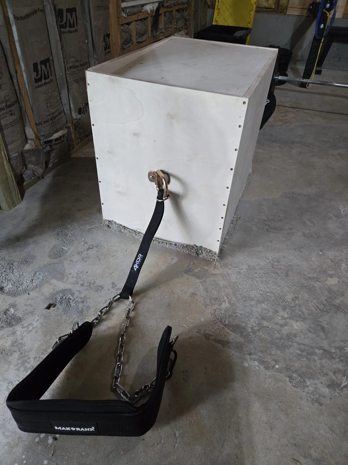 My DIY plywood sled connected to the MAXRANK dip belt via chain — simple, cheap, and effective for reverse sled pulls